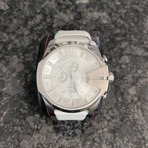 Used Diesel watch. Shows signs on wear. Needs a new battery Xl watch face